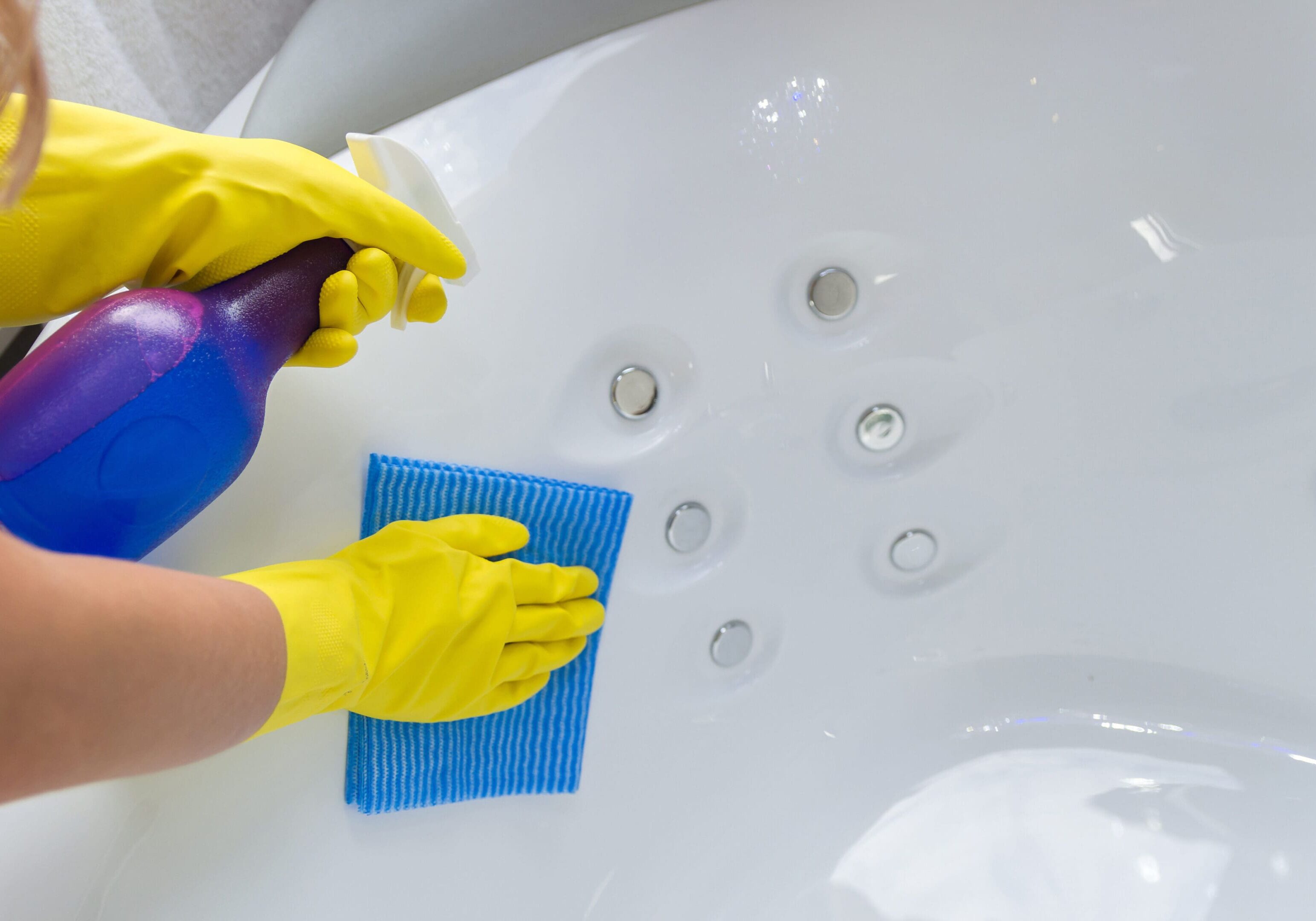 Great concept of domestic cleaning, hand with glove cleaning bath.